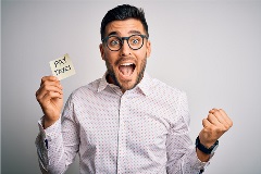 Excited man with a sticky note that says "Pay Taxes."